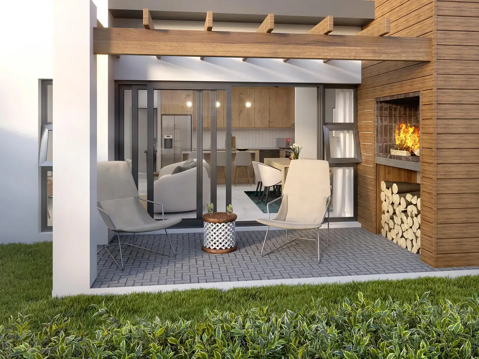 Covered patio with a built-in braai opening onto a private lawn