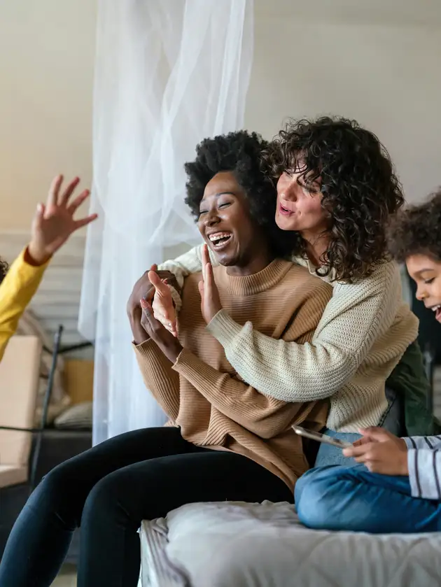 A family laughing together at home