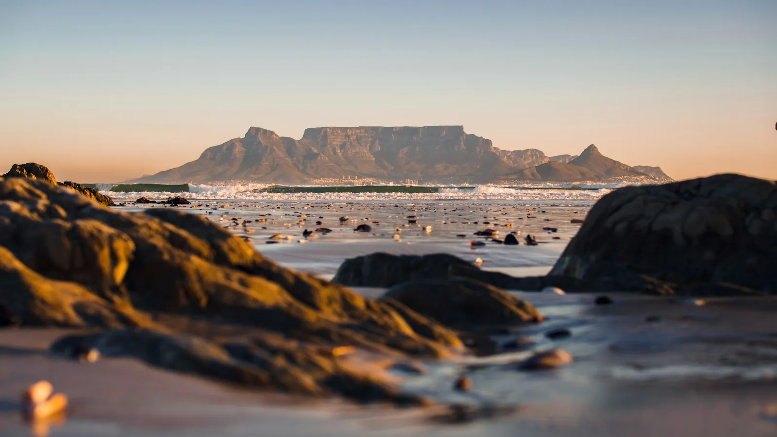 Table Mountain seen across Table Bay from the Blouberg shoreline at sunset