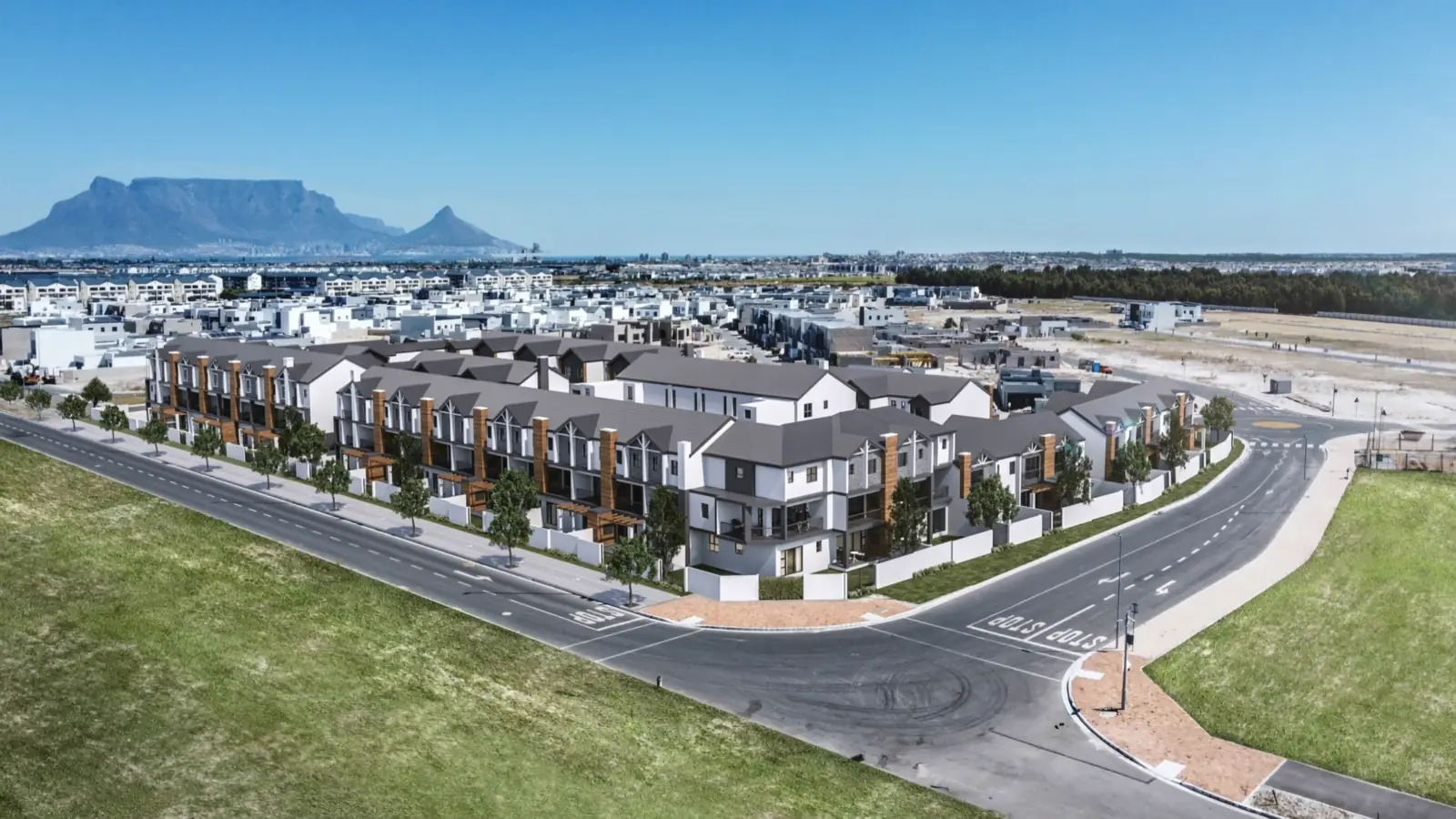 Aerial view of Summit Villas in Sandown with Table Mountain across Table Bay